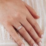 Emerald cut diamond New horizon ring in Platinum on hand Emerald cut diamond New horizon ring in Platinum on hand